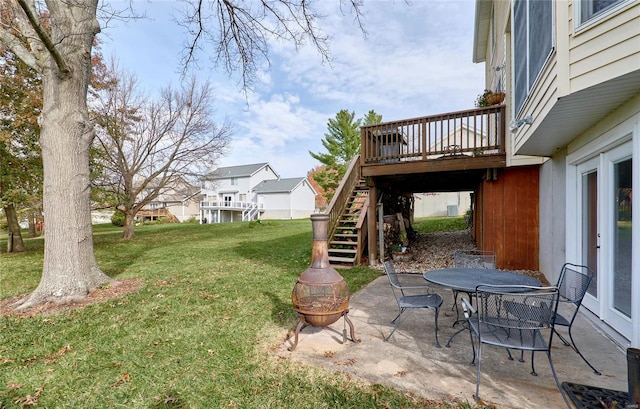 view of yard with a patio area and a wooden deck