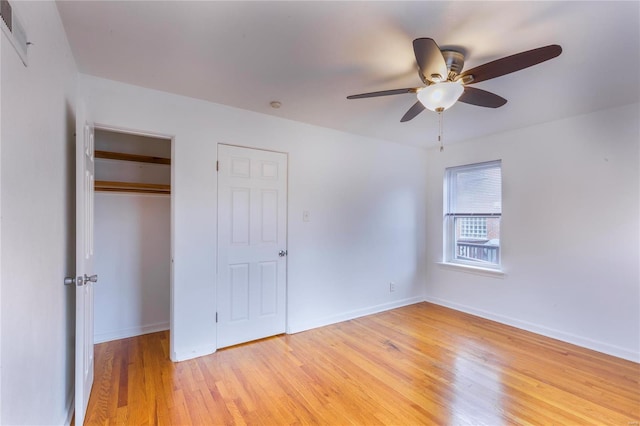 unfurnished bedroom featuring ceiling fan and light hardwood / wood-style flooring