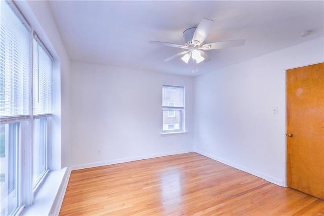 unfurnished room featuring ceiling fan, a healthy amount of sunlight, and light hardwood / wood-style flooring