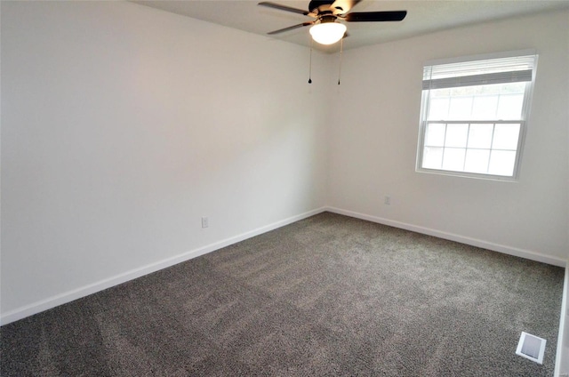 empty room featuring carpet and ceiling fan