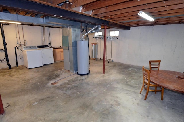 basement with washer and clothes dryer and gas water heater