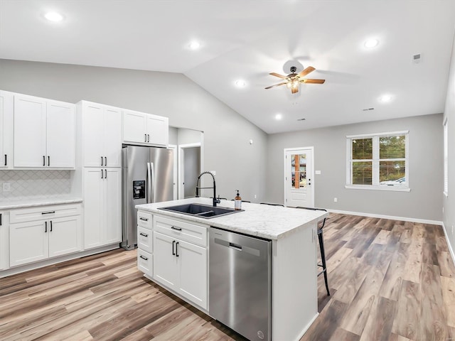 kitchen with white cabinets, stainless steel appliances, and sink