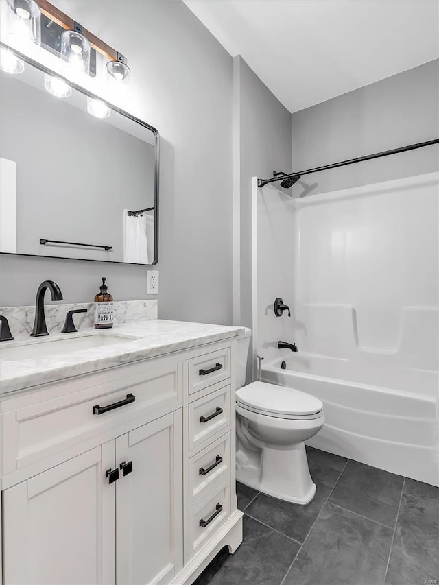 full bathroom with toilet, vanity, tile patterned floors, and shower / bathtub combination