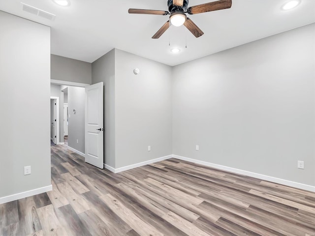 unfurnished room featuring light hardwood / wood-style floors and ceiling fan