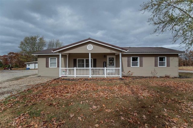 ranch-style house with covered porch