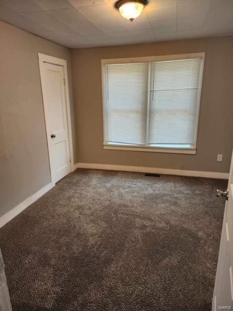 empty room with carpet and plenty of natural light