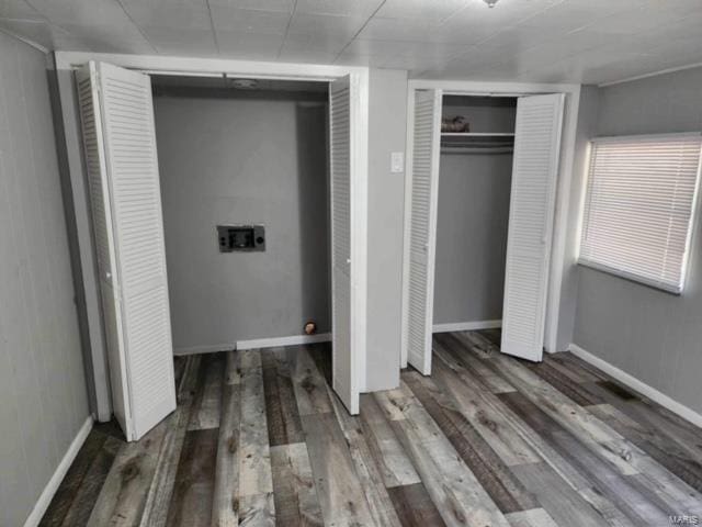 unfurnished bedroom with dark hardwood / wood-style floors