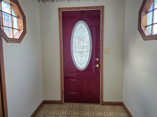 foyer entrance with a wealth of natural light