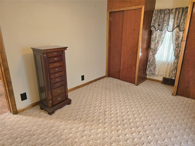 unfurnished bedroom featuring light colored carpet