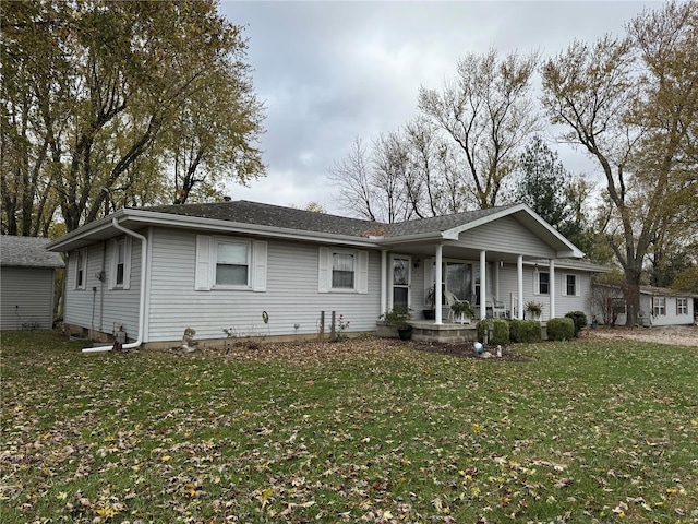 ranch-style house with covered porch and a front lawn