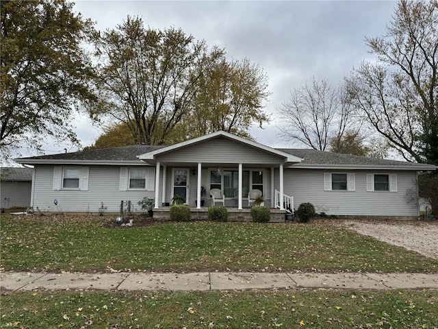 single story home featuring a porch and a front yard