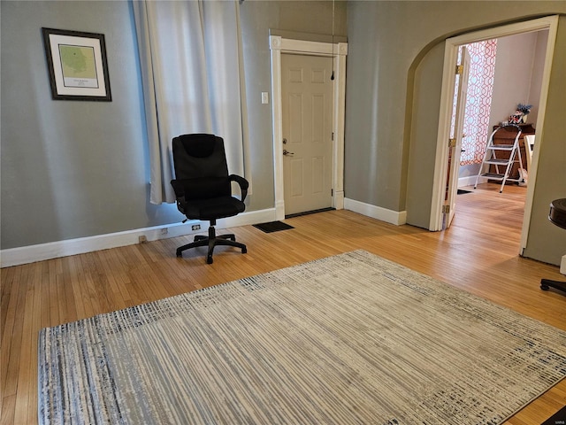 unfurnished office featuring light wood-type flooring