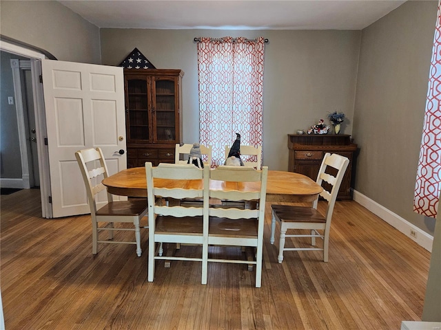 dining area with wood-type flooring