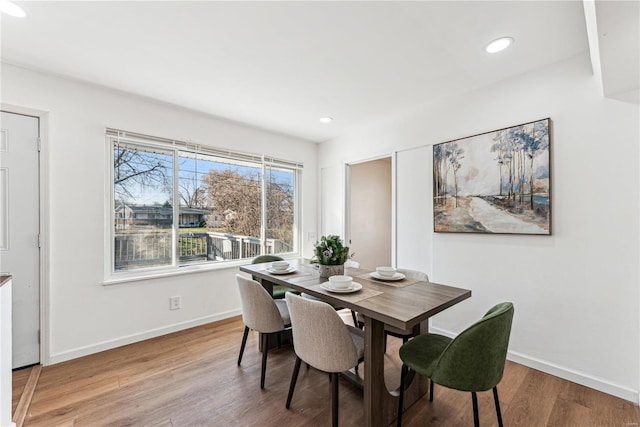 dining room with light wood-type flooring