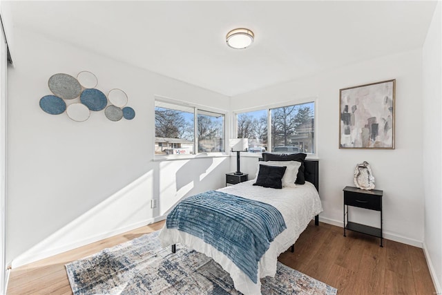 bedroom with hardwood / wood-style flooring