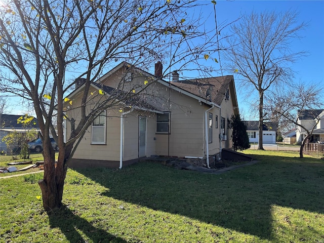 view of home's exterior with a yard