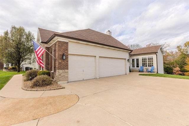 view of side of property featuring a garage