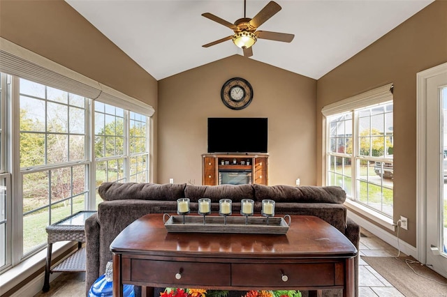 living room with lofted ceiling and a healthy amount of sunlight