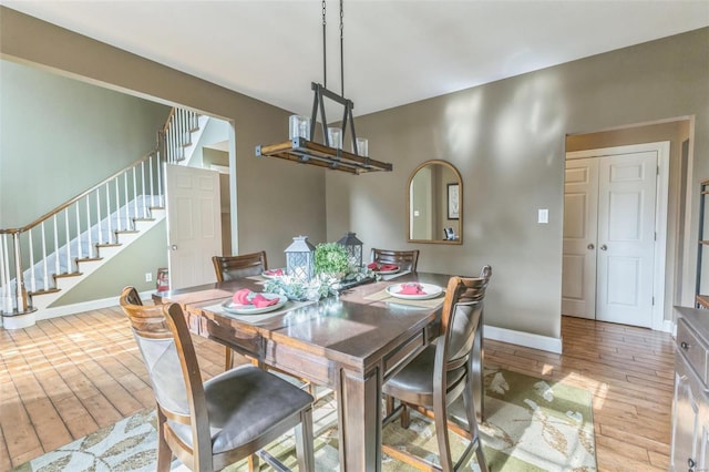 dining area with light wood-type flooring