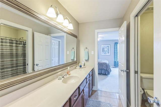 bathroom with tile patterned floors, vanity, and toilet