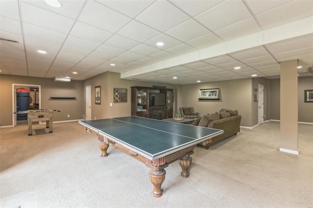 playroom featuring a paneled ceiling and light colored carpet