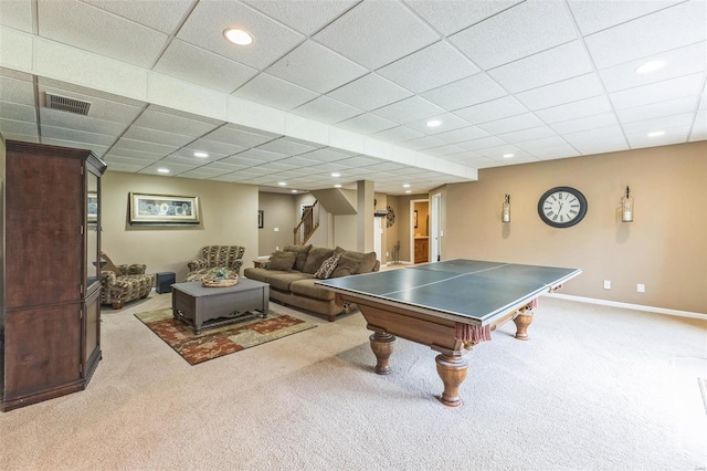 rec room featuring a paneled ceiling and light carpet