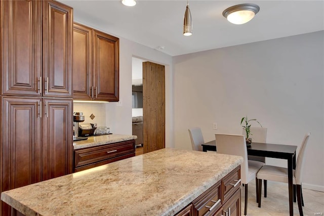 kitchen with decorative light fixtures and decorative backsplash