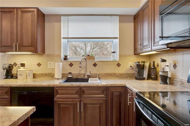 kitchen featuring sink, backsplash, and appliances with stainless steel finishes