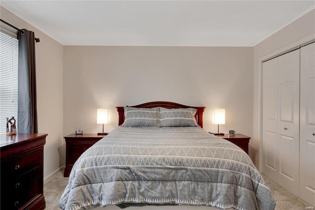 carpeted bedroom with a closet