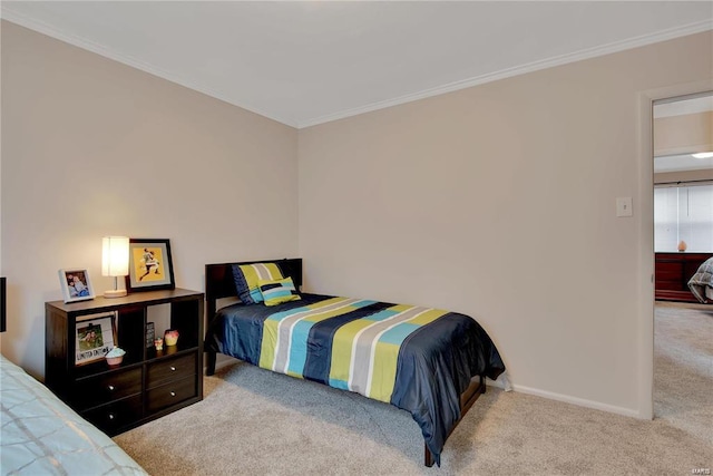 carpeted bedroom with ornamental molding