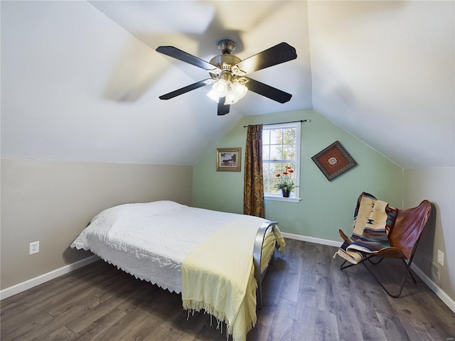 bedroom featuring ceiling fan, dark hardwood / wood-style floors, and vaulted ceiling