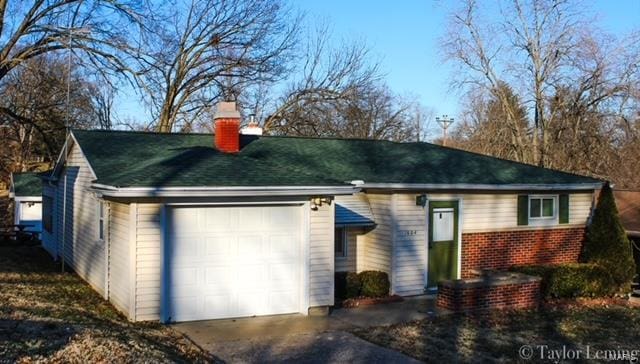 ranch-style home featuring a garage