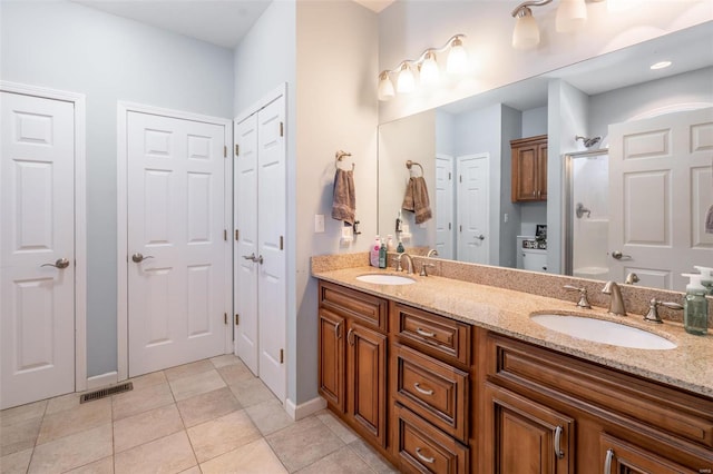 bathroom with vanity, tile patterned floors, and an enclosed shower