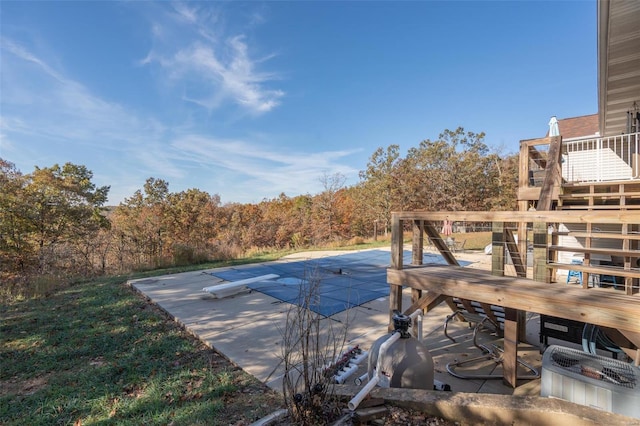 view of pool featuring a diving board and a deck