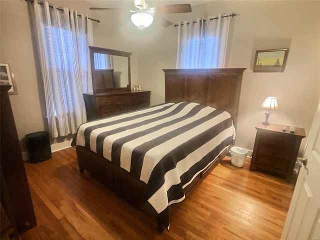 bedroom with hardwood / wood-style flooring and ceiling fan