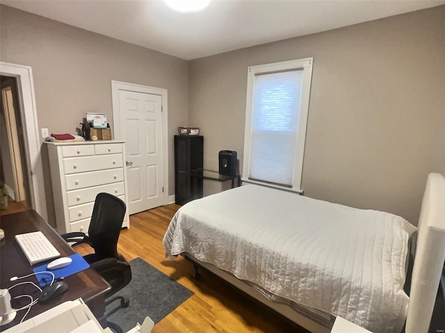 bedroom with hardwood / wood-style flooring