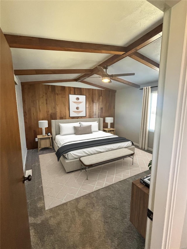 carpeted bedroom featuring lofted ceiling with beams, wood walls, and ceiling fan