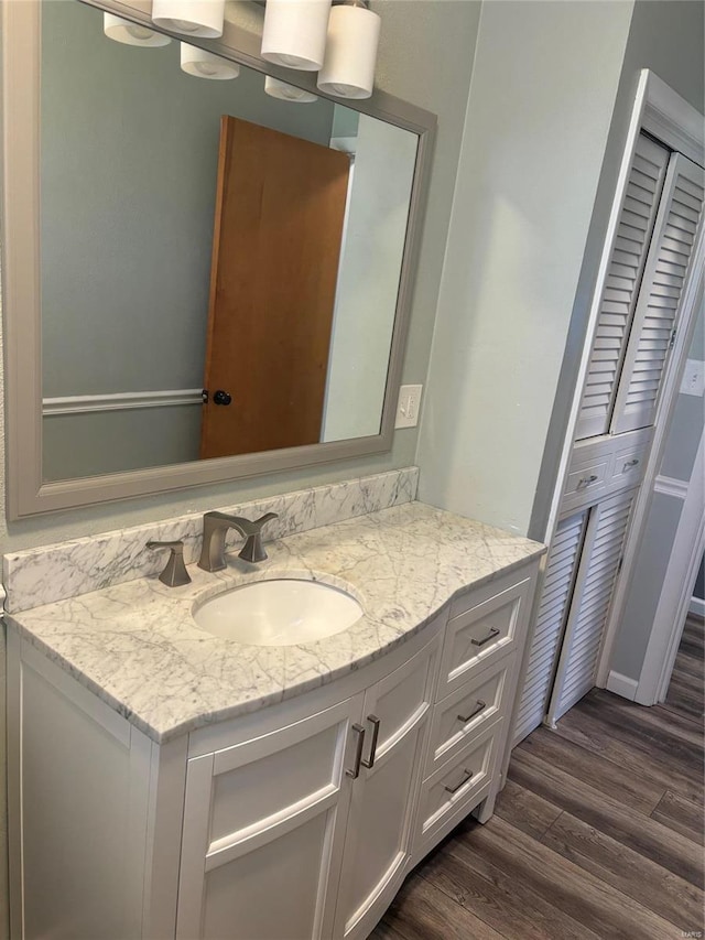 bathroom with wood-type flooring and vanity