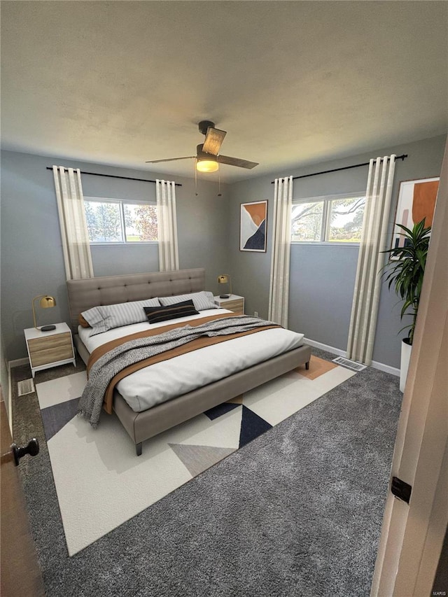 carpeted bedroom featuring ceiling fan