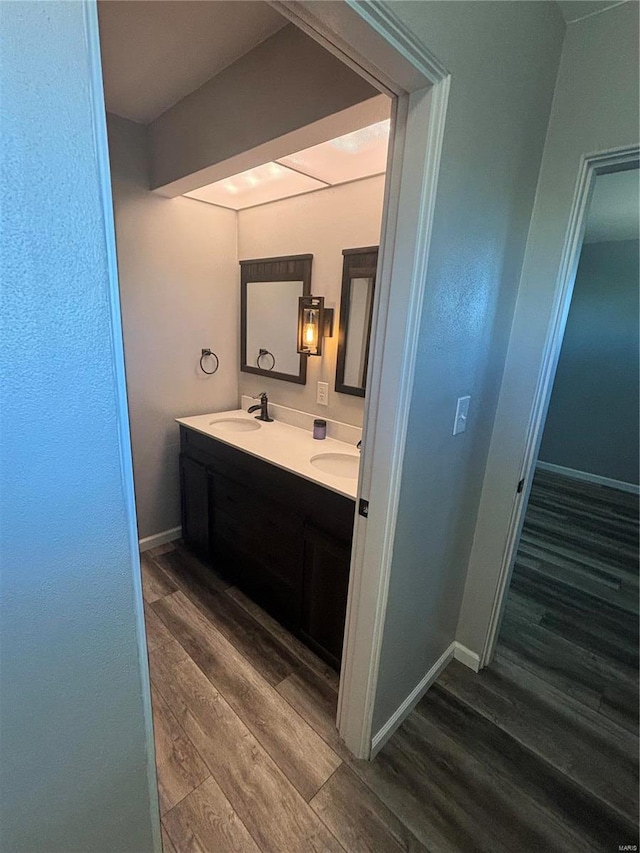 bathroom featuring hardwood / wood-style flooring and vanity