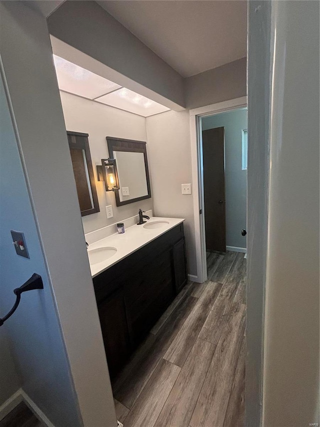 bathroom featuring wood-type flooring and vanity