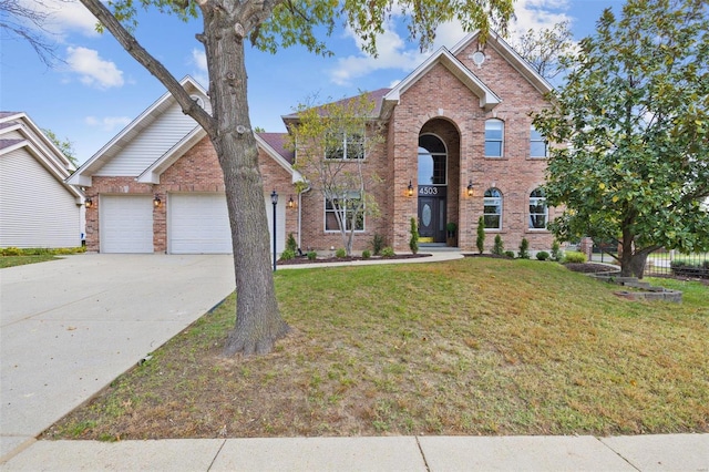 front of property featuring a garage and a front lawn