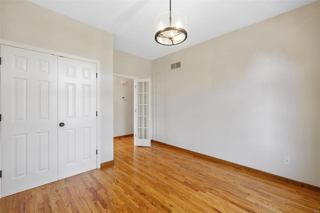 spare room featuring light wood-type flooring