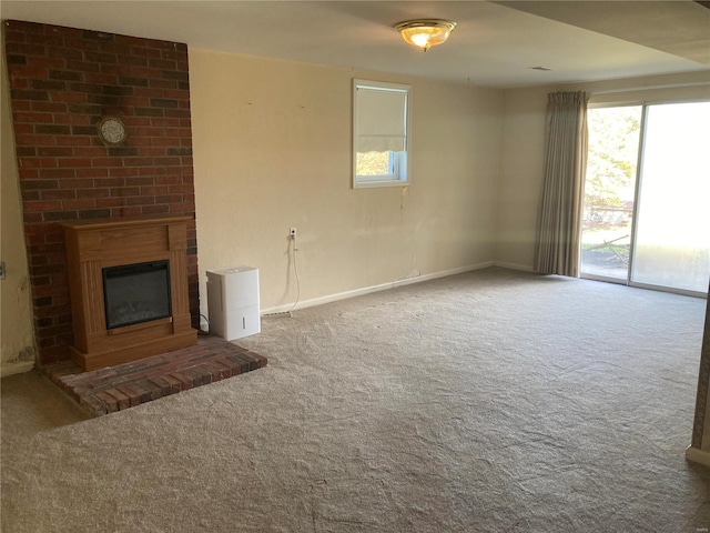 unfurnished living room featuring carpet and a fireplace