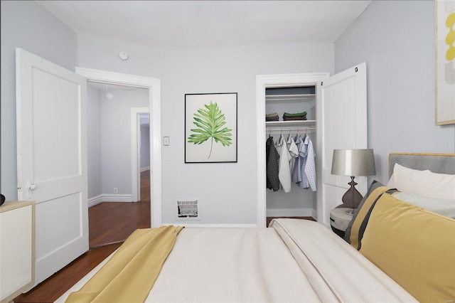 bedroom featuring a closet and dark hardwood / wood-style flooring