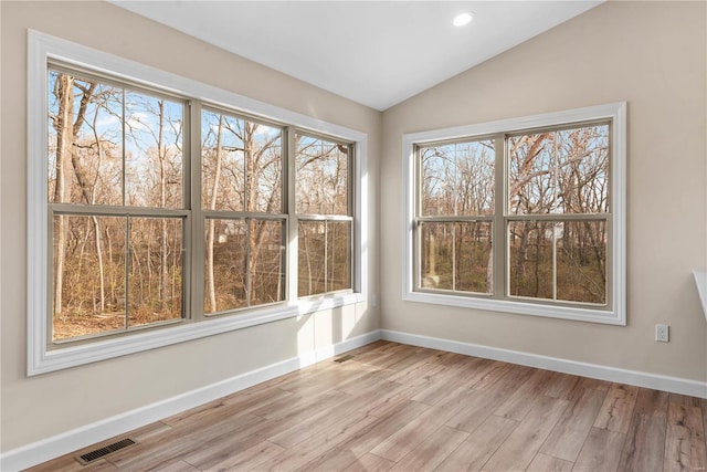 interior space featuring light hardwood / wood-style flooring and vaulted ceiling