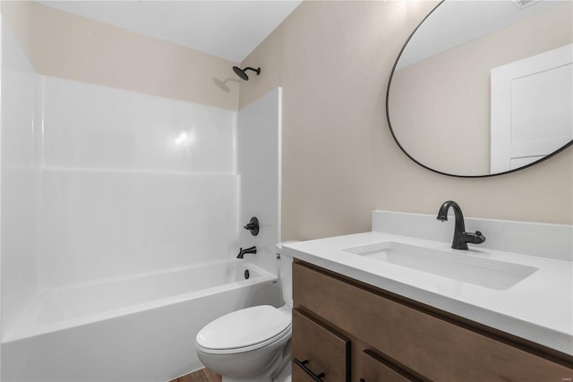 full bathroom with vanity,  shower combination, and toilet