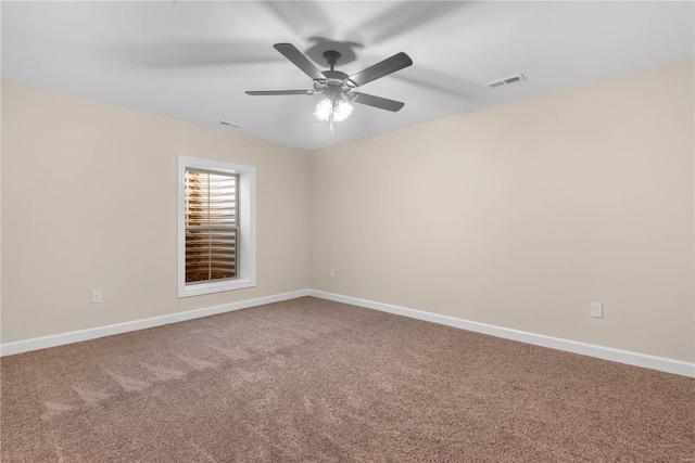 carpeted empty room with ceiling fan