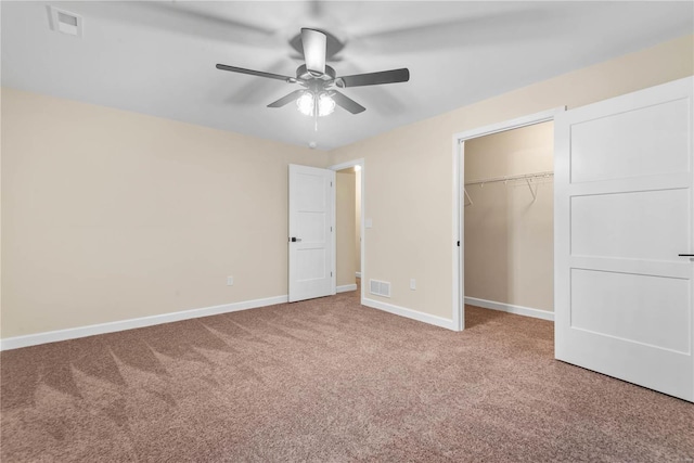 unfurnished bedroom with ceiling fan, carpet floors, and a closet