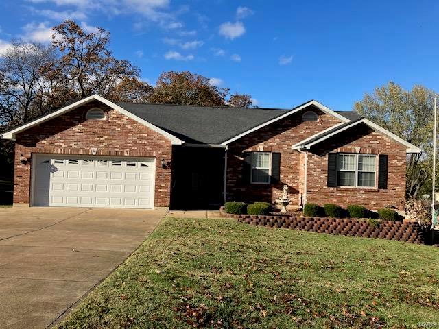 single story home with a garage and a front lawn